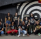 PJ, da banda Jota Quest posa ao lado de modelos usando as camisetas da Paranoid Music Store